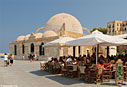 Caf&eacute; and mosque in the harbour of Chania