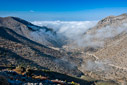 Clouds rising up a mountain valley 