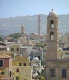 Chania rooftops with the chirch tower of the cathedral (foreground) as well as the church tower of Agios Nikolaos and its minaret further back